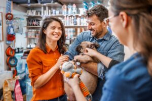 Couple buying dog a toy