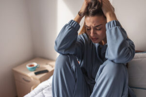 Stock image of upset woman.