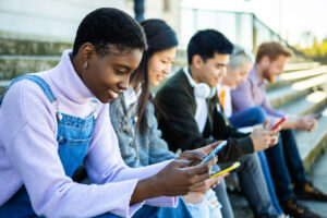 Stock image on millennials on phones.