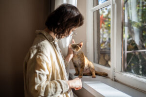 woman petting a cat