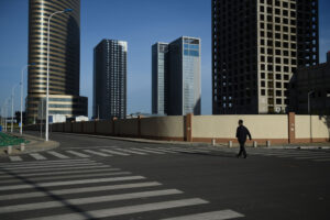 Man Walks Down Street in Yujiapu