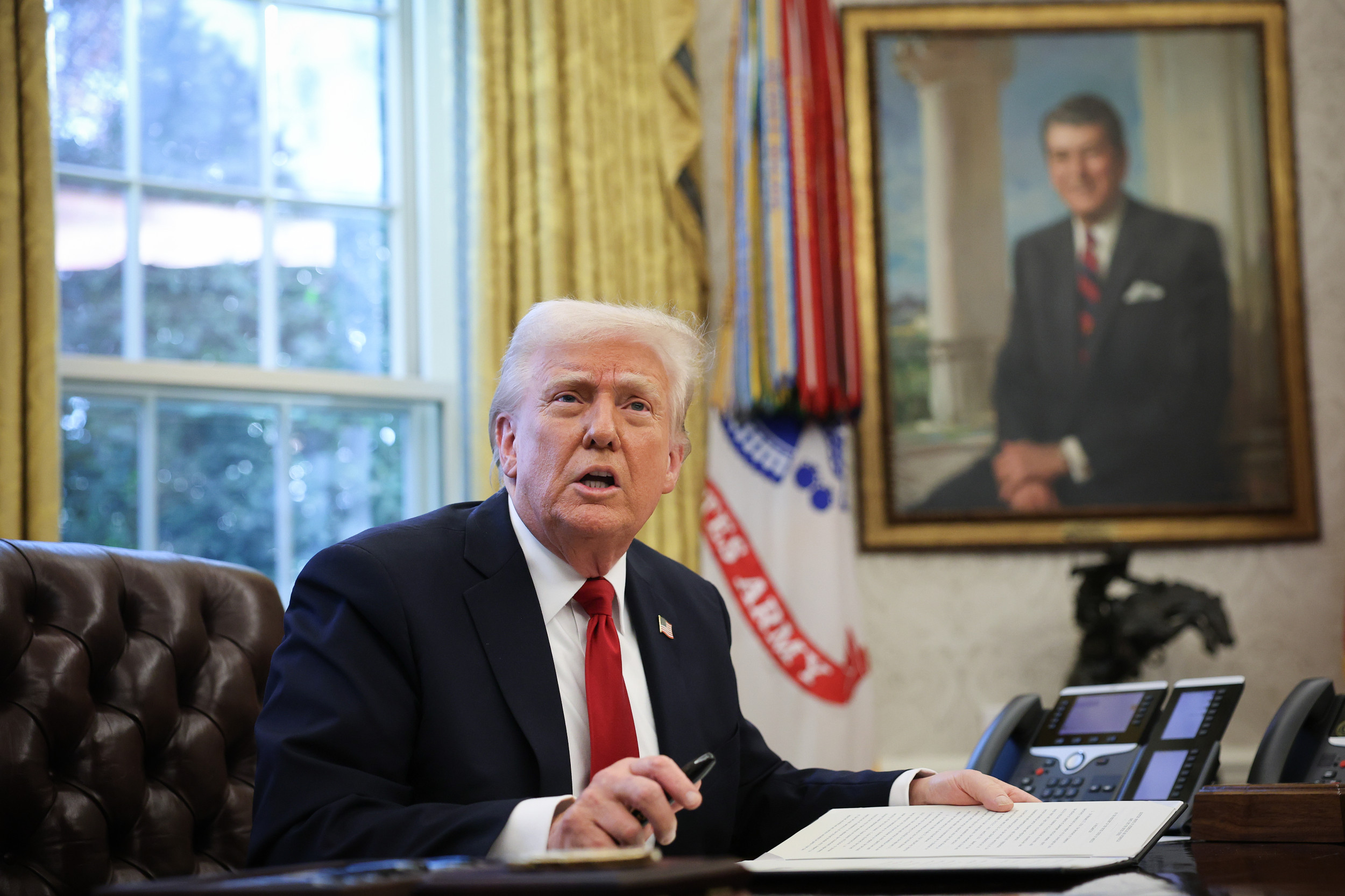 Donald Trump signing Oval Office