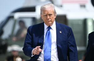 President Donald Trump gestures as he walks
