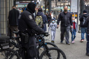 A family walks past Seattle police
