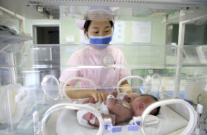 Nurse Attends to Newborn in Jiangsu Province