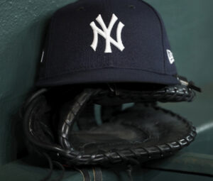 Yankees hat on glove