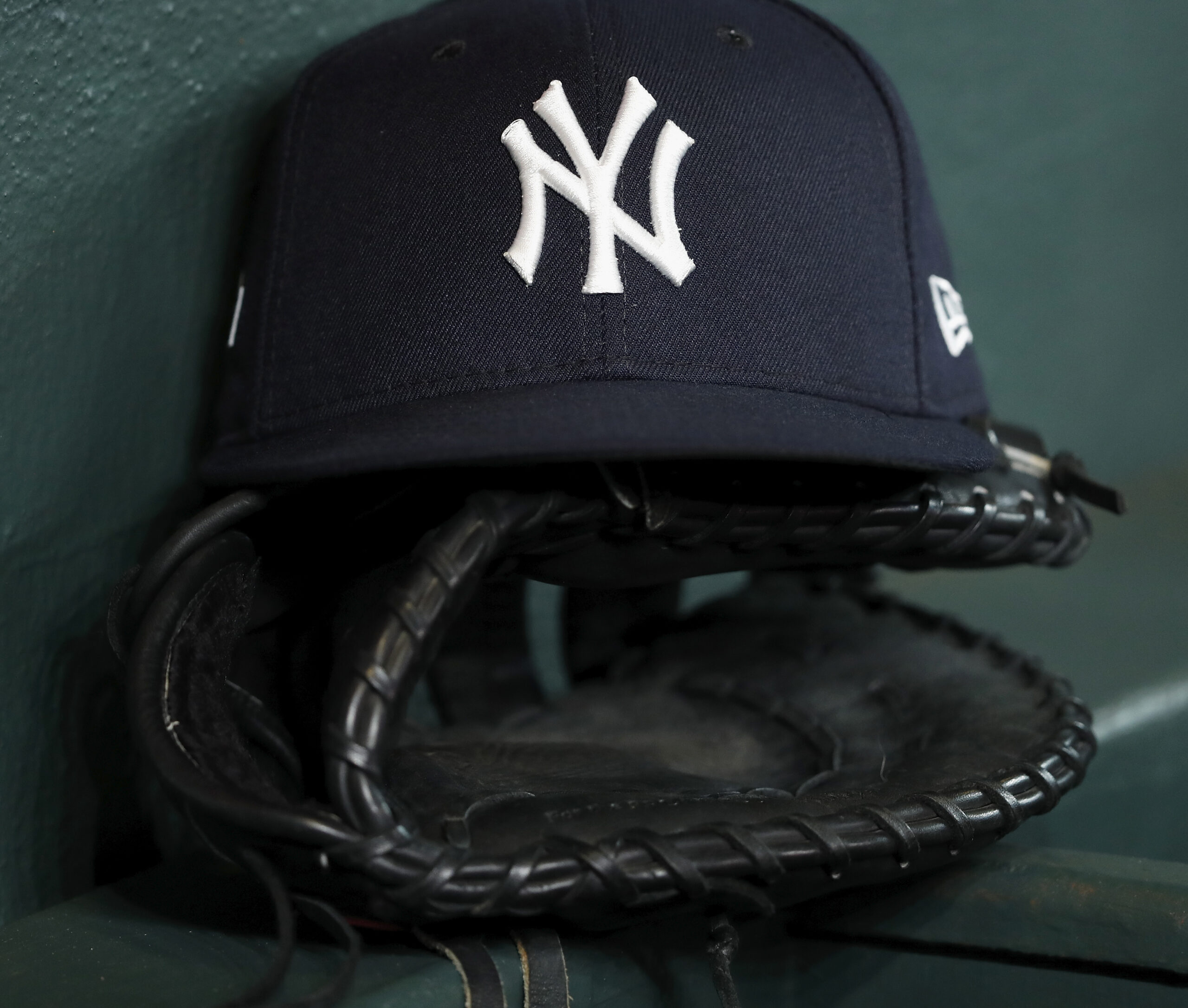 Yankees hat on glove