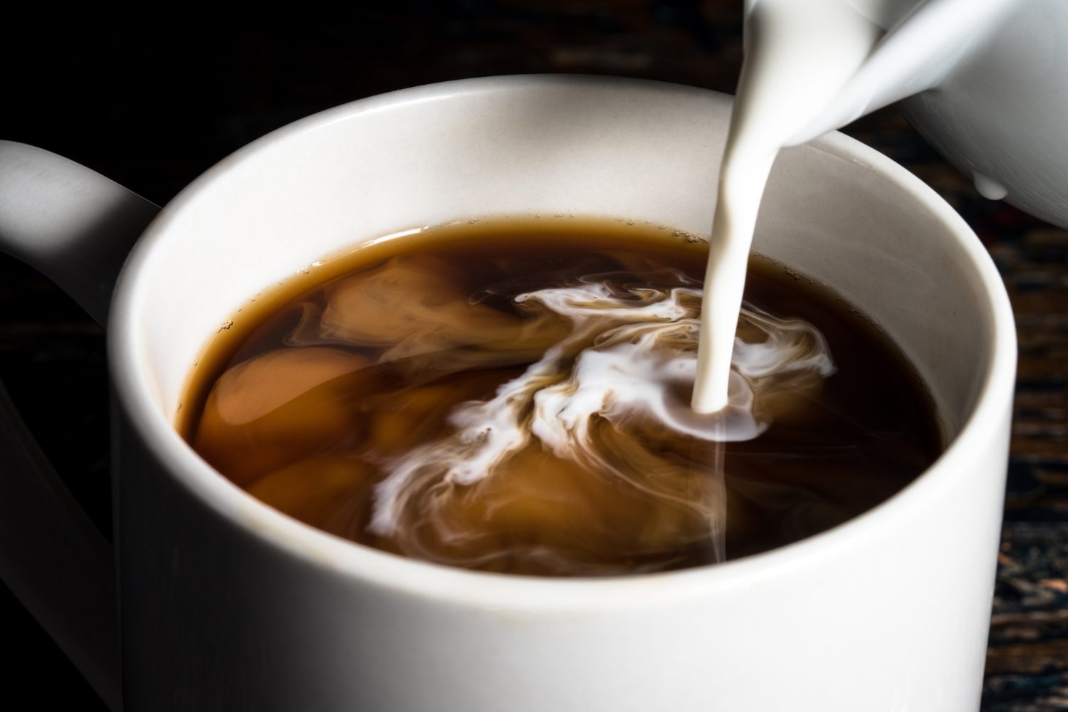 Creamer into coffee