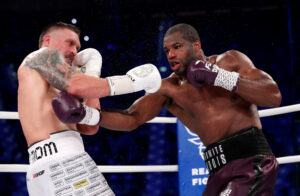 Oleksandr Usyk exchanges punches with Daniel Dubois