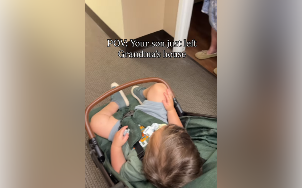 A woman watches her grandma do something.