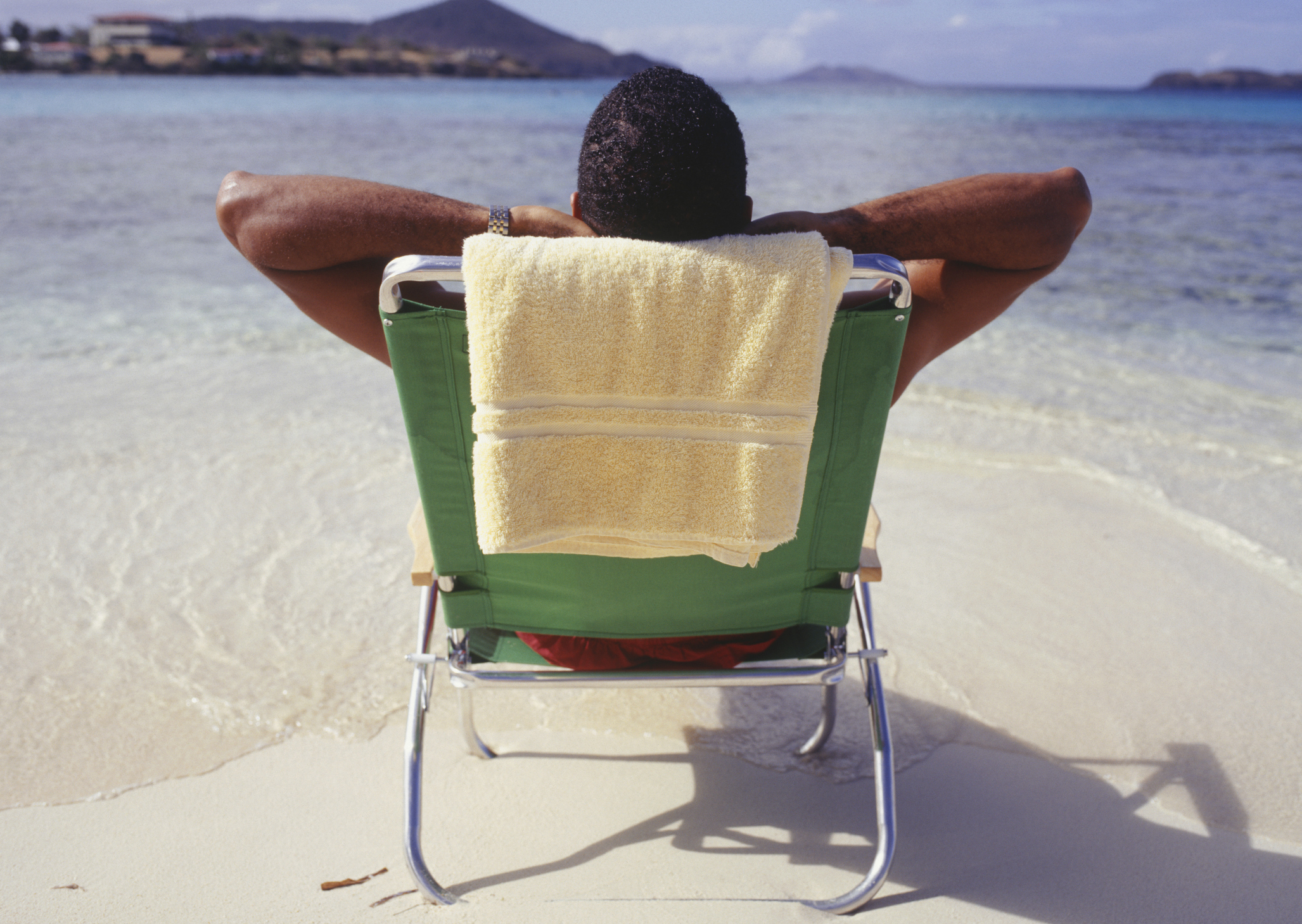 A man sunbathes at the beach