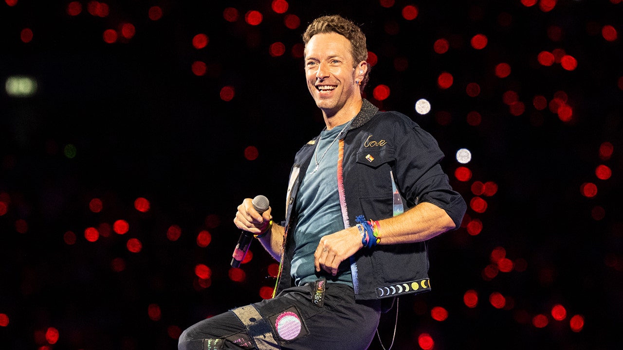 Chris Martin helps fan propose at Coldplay concert after cheating scandal