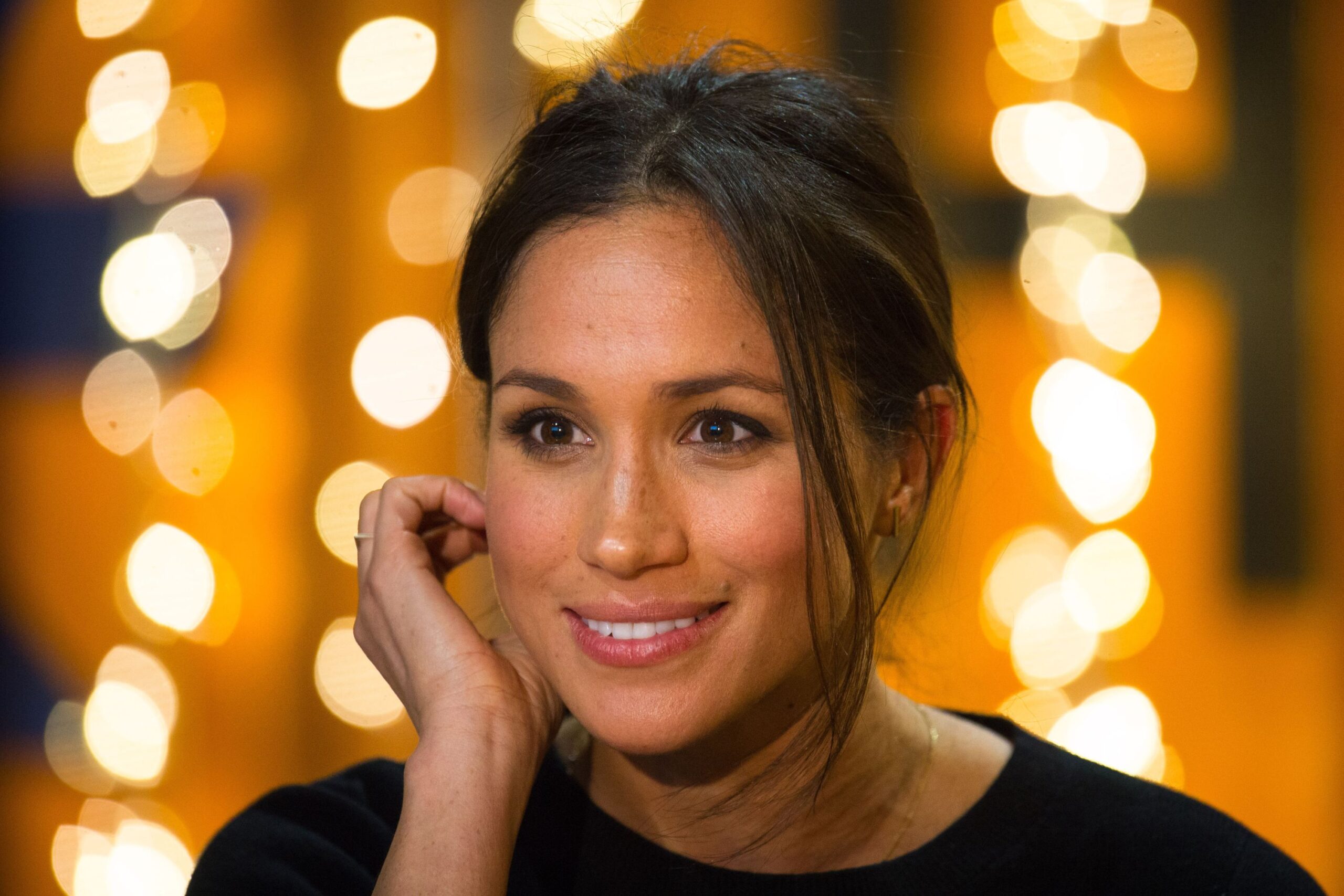 Meghan Markle Smiles in Front of Lights